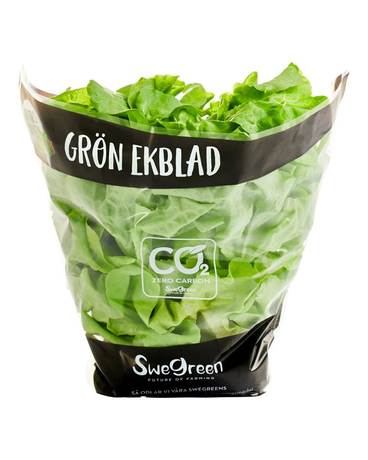 Grön ekblad i Swegreens påse märkt Butiksodlat